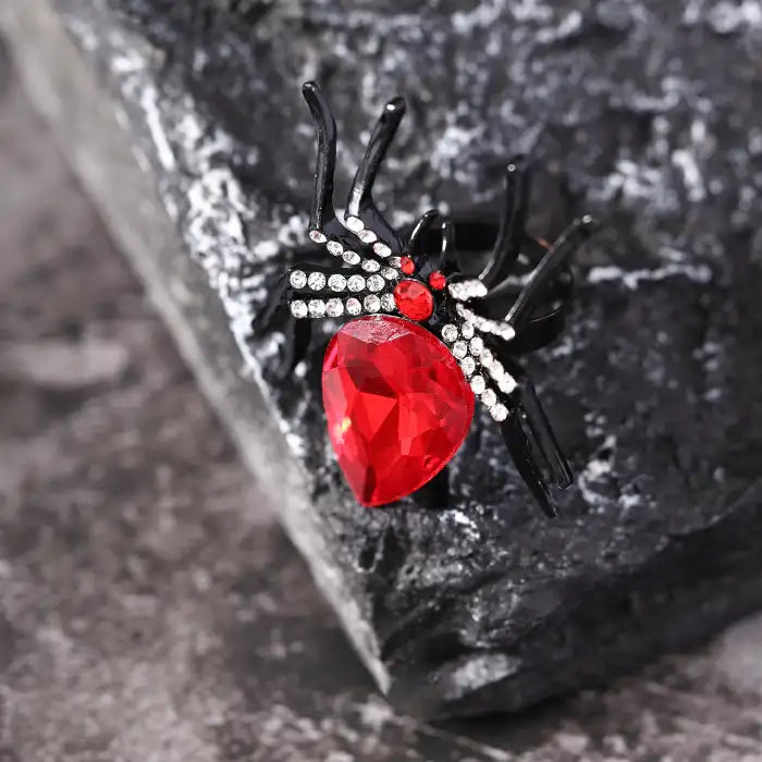 Blackwidow Spider rings featuring closeup view of large red crystal with diamond-accented legs