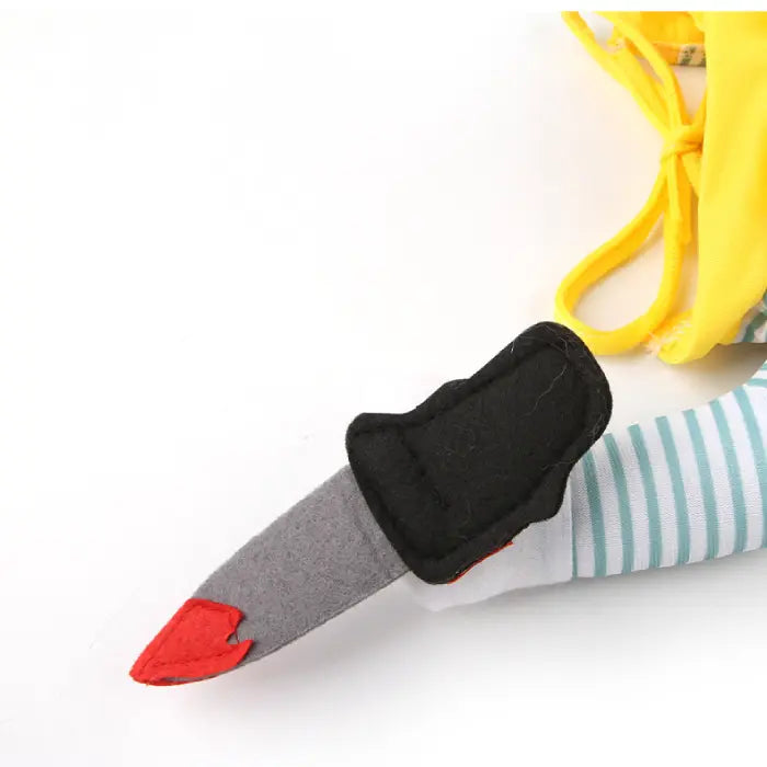Close-up of Cat Halloween costume plush knife arm with red tip and black felt handle details.