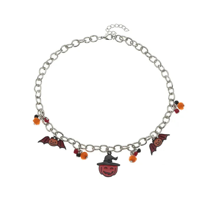 Flat lay of Halloween costume necklace with orange beads and pumpkin bat charms on gray surface.