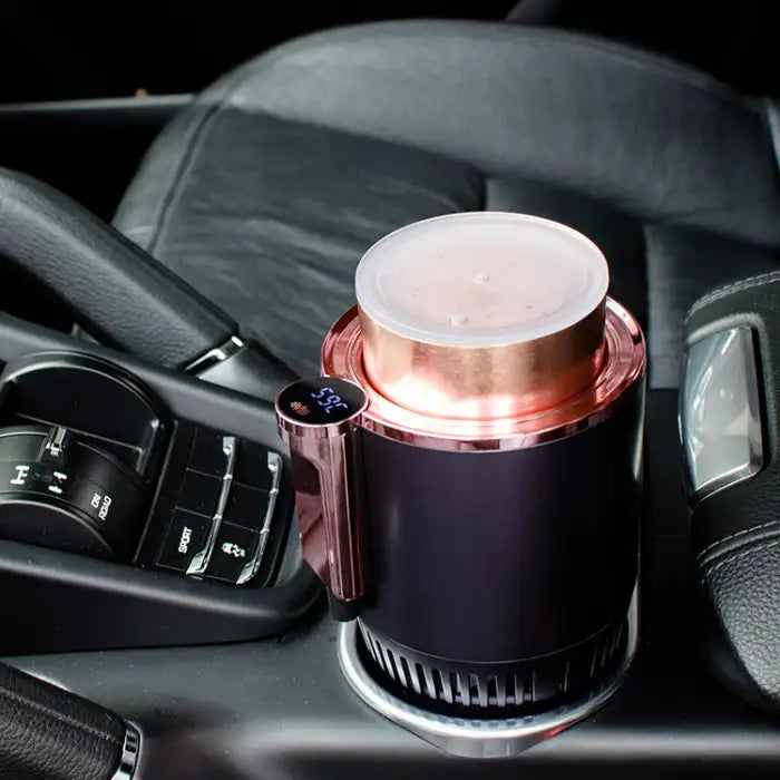 Car Heating Cooling Cup Holder heating beverage in luxury car with digital temperature screen visible.