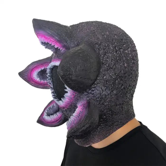 Halloween Alien Mask side view showing multiple purple mouths and black scale-like surface texture.