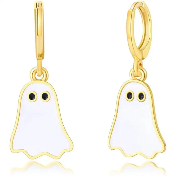 Close-up of gold hoop Halloween earrings with white enamel ghost charms and black eyes.