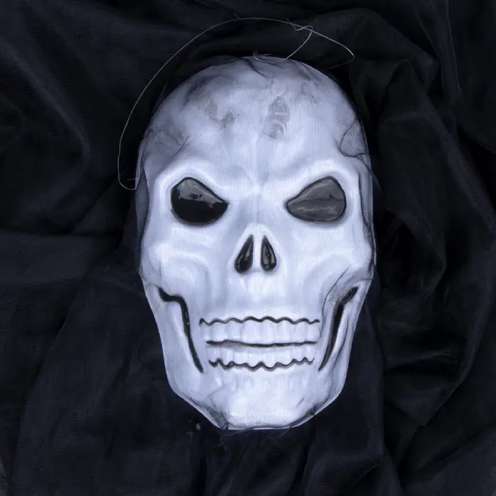 Halloween Ghost Skull face mask with sunken eyes and cracked teeth on black fabric.