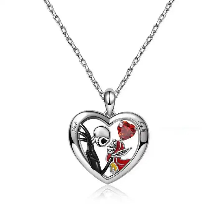 Close-up of Halloween Gothic necklace showing Jack and Sally in silver heart with red gemstone