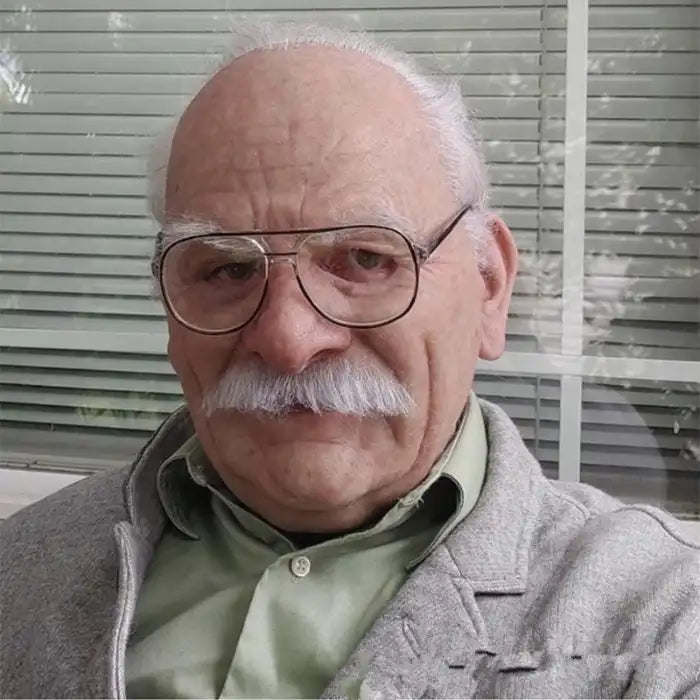 Halloween Mask showing old man with white mustache, bald head, and wearing glasses and gray jacket