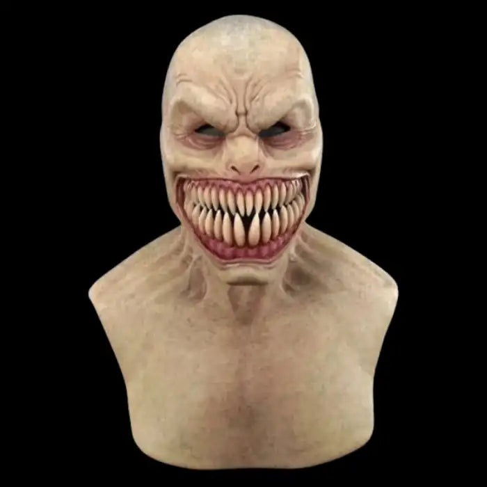 Halloween Mask of creepy monster with bald head and huge sharp teeth in an evil wide grin