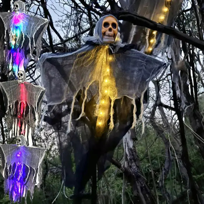 Halloween skeleton ghosts with multicolor and yellow lights hanging on tree for spooky outdoor decorations.