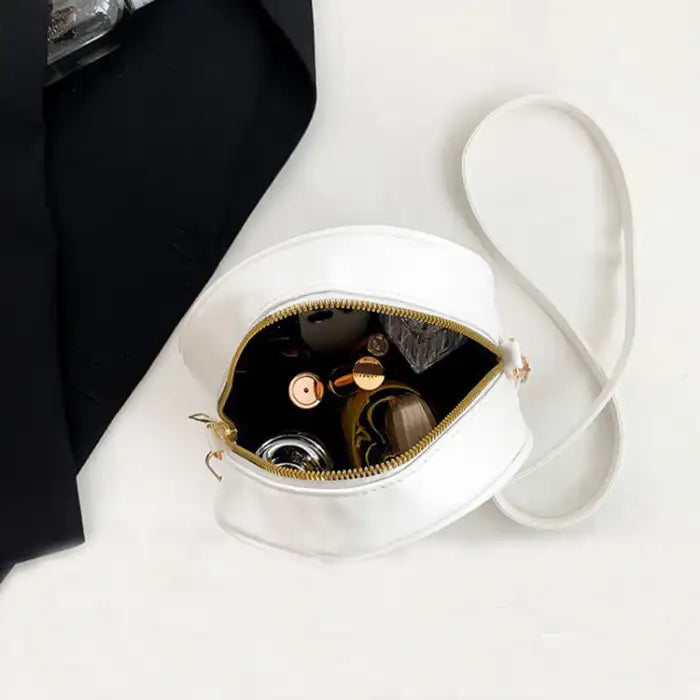 Halloween Skull Bag open to show spacious interior holding beauty items and essentials.