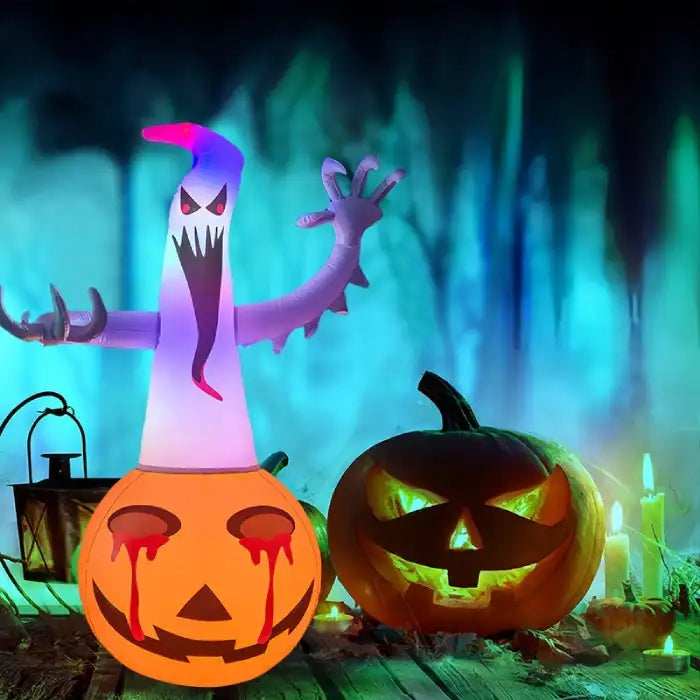 Halloween yard inflatables ghost with glowing pumpkin base surrounded by jack-o'-lanterns and candles.