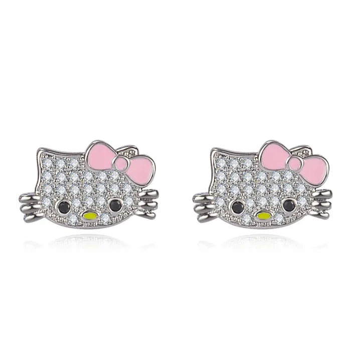 Hello kitty stud earrings from jewelry set featuring pink bows and crystal-studded design.