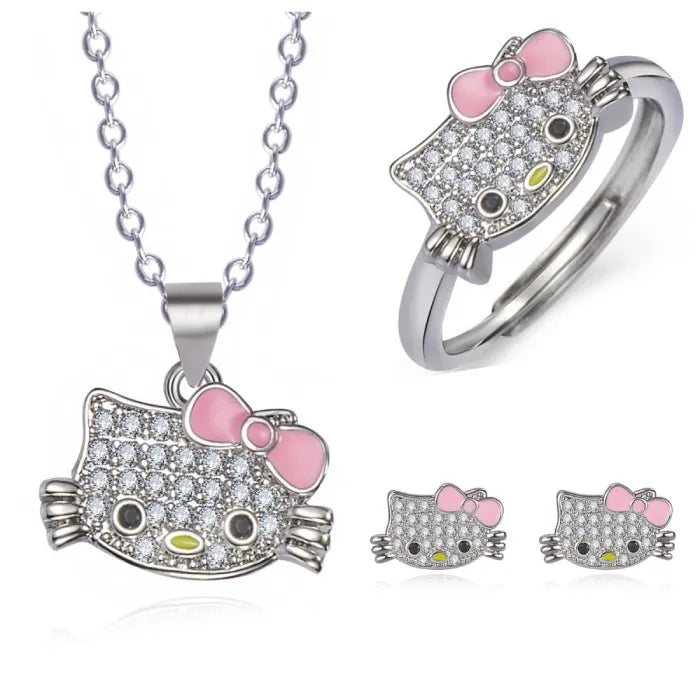 Hello kitty jewelry set with necklace, ring, and earrings featuring pink bows and crystal accents.