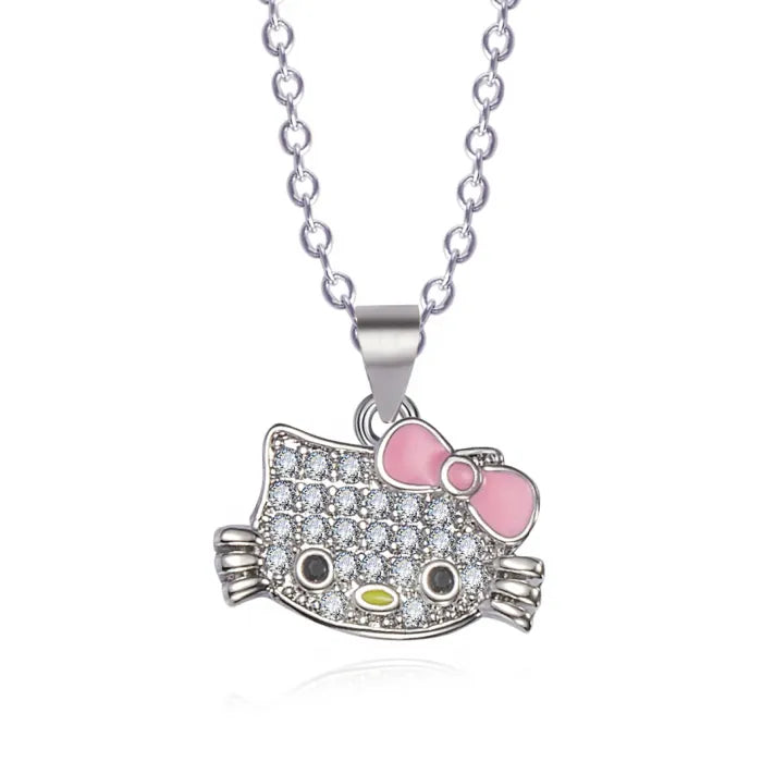 Hello kitty necklace from jewelry set with pink bow and crystal details on silver chain.