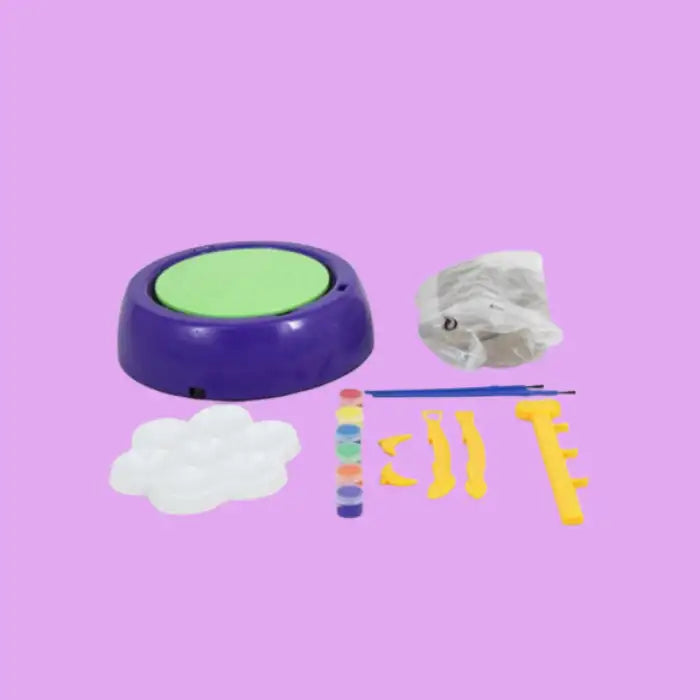 Kids Pottery Wheel Kit with included tools, paint, brush, clay, and spinning base