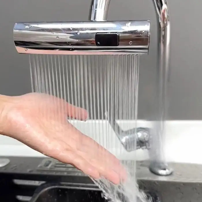 Demonstration of kitchen faucet in rainfall mode with even spray stream onto a hand.