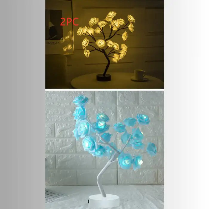 LED tree lamp with glowing warm white rose flowers on black branches, used as cozy ambient table lighting.