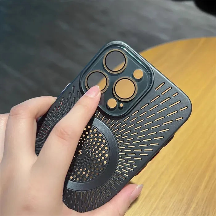 Magnetic wireless phone case in dark grey with close-up of finger touching protective camera lens ring.