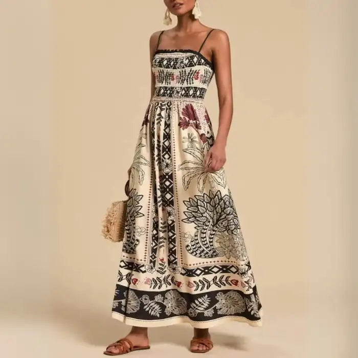 Maxi dress with tribal-style black and burgundy print and sleeveless cut in flowing fabric.