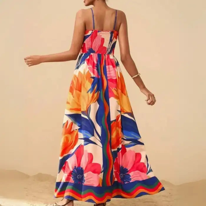 Maxi dress back view with colorful tropical floral print and fitted smocked top.