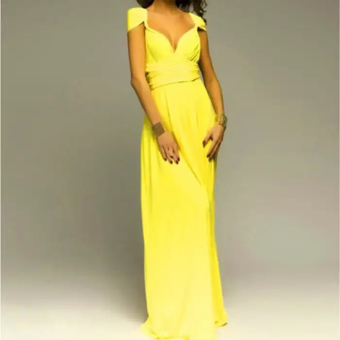 Multiway dress in bright yellow styled with cap sleeves, wrap bodice, and sweetheart neckline.