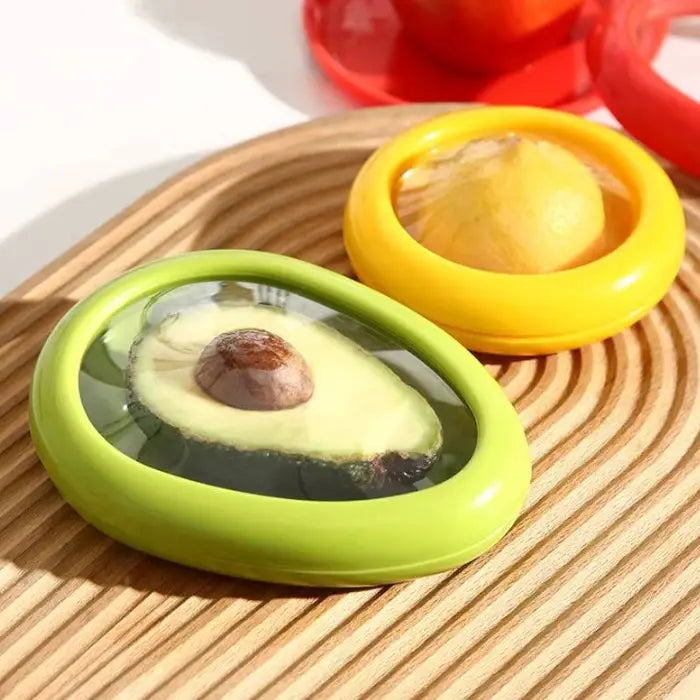 reusable avocado and lemon storage containers displayed on bamboo cutting board showing fresh produce preservation