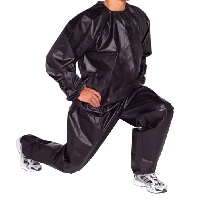 Sauna suit in black worn by man kneeling, designed for intense sweat sessions and weight loss training.