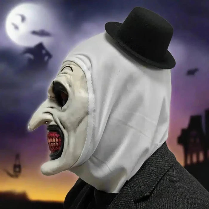 Scary Clown Mask side view showing long nose, sinister smile, and top hat in eerie night scene