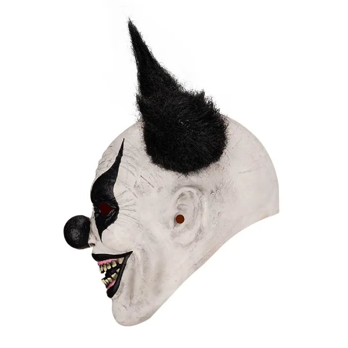 Side profile of scary full head latex clown mask showing long teeth and black nose.