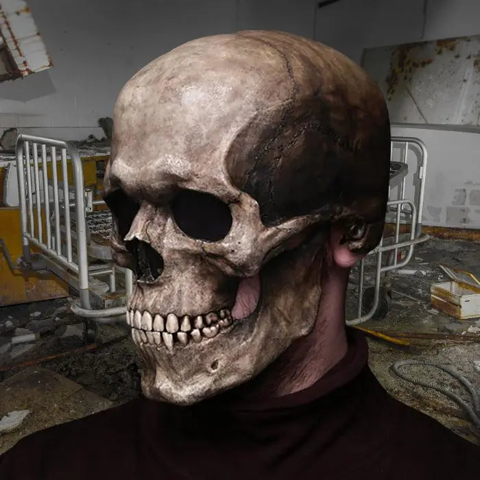 Skull mask worn in creepy abandoned hospital setting, featuring decayed beds and eerie lighting.