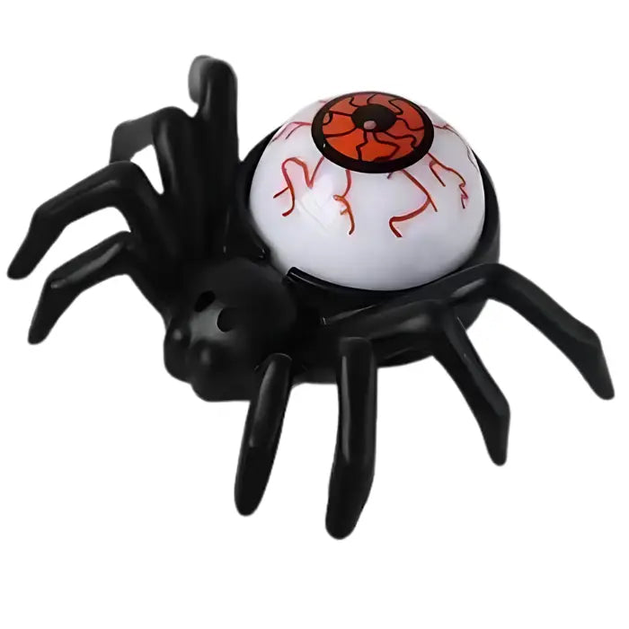 Halloween spider candle featuring large orange bloodshot eyeball as body centerpiece.