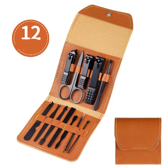 Tan leather manicure set with nail clippers, scissors and grooming tools in compact folding case