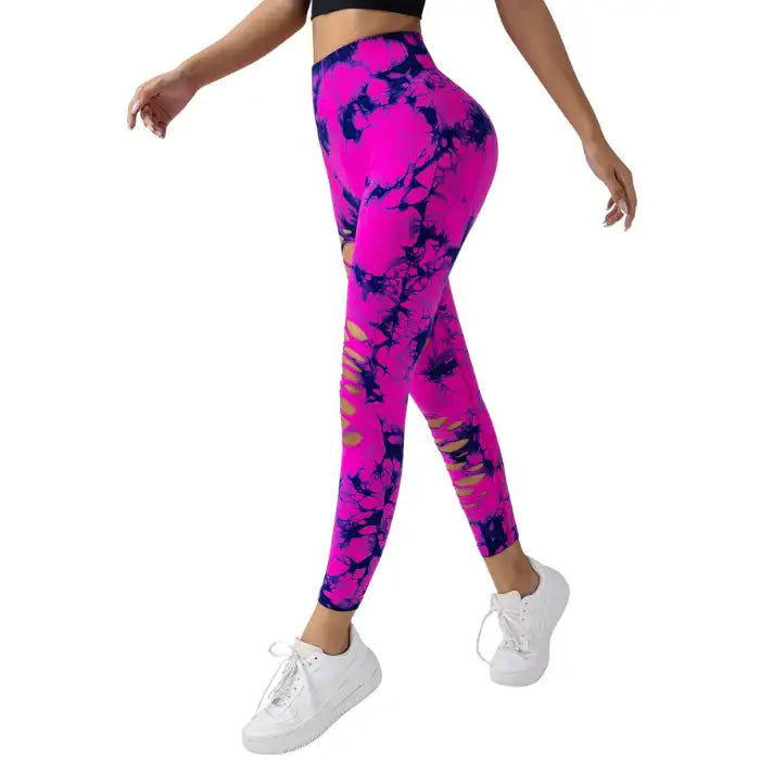 Tummy Control Yoga Pants in pink with black tie-dye and side slits, shown in side walking pose.