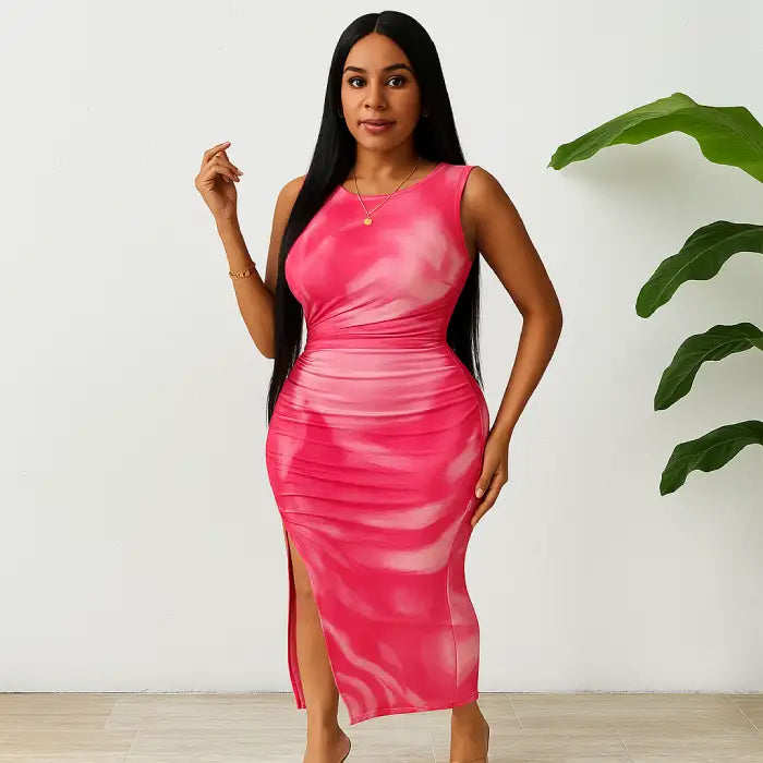 Pink tye dye form-fitting dress with a sleeveless design, side slit, and ruched sides for a chic summer look.