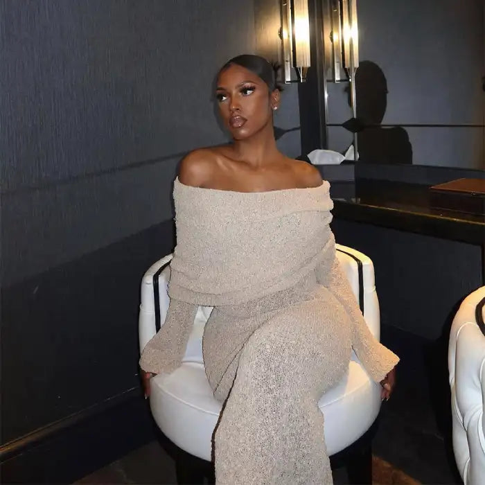 Women's one-shoulder long-sleeve knitted vacation dress in beige styled for an evening setting.