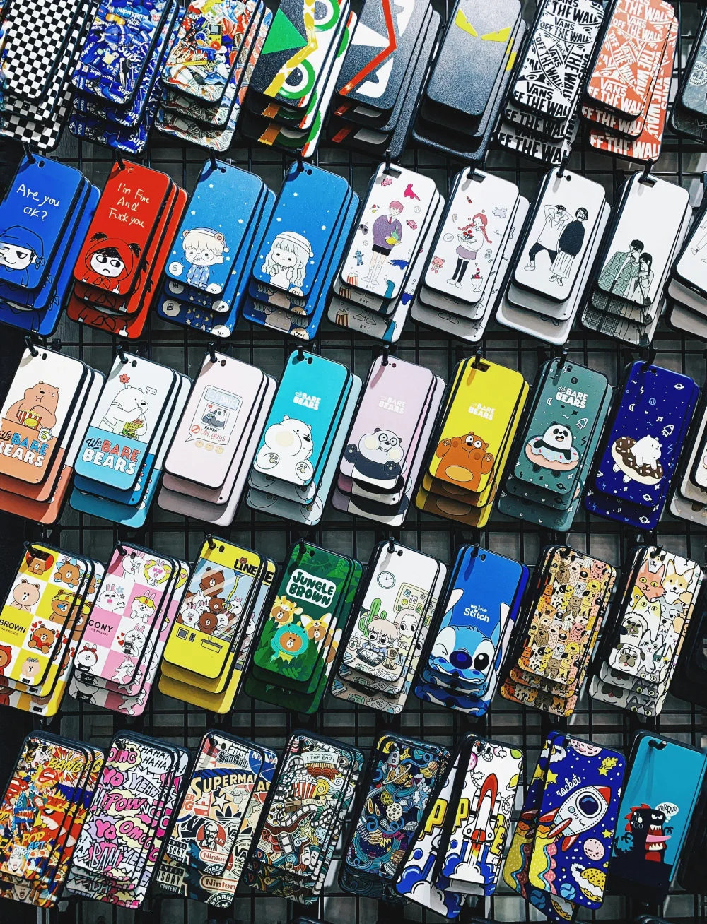 phone cases on wall display showing android phone cases and iphone phone cases