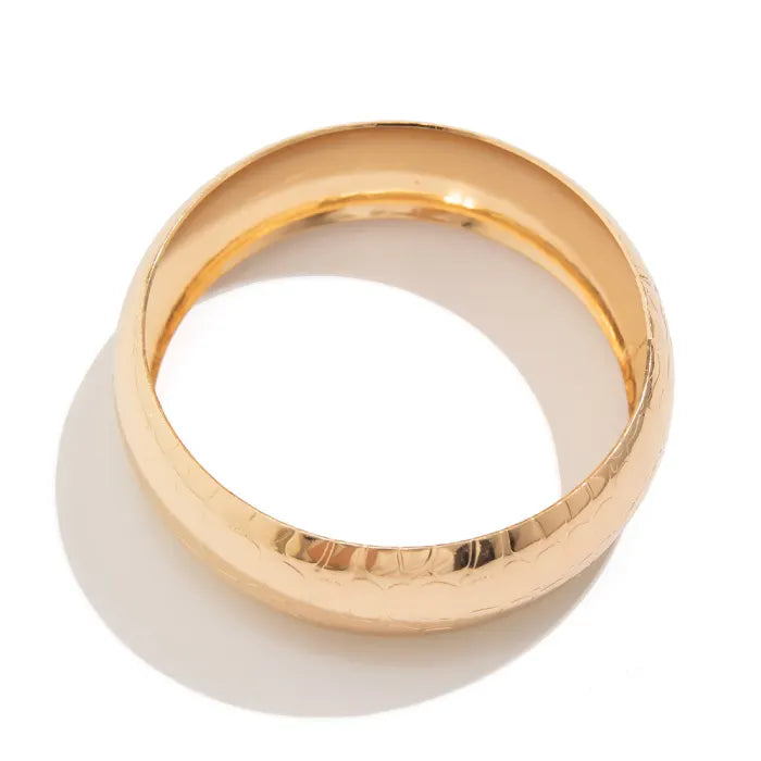 Gold ring on a white background