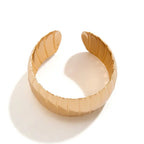 Gold bracelet on a white background