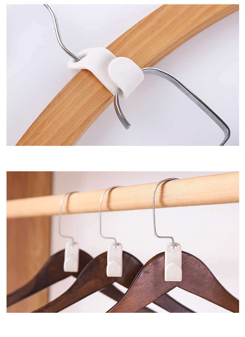 White clip on a wooden hanger against a white background
