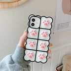 3D silicone phone case with white background and pink cat paw prints in grid pattern creating cute protective iPhone cover