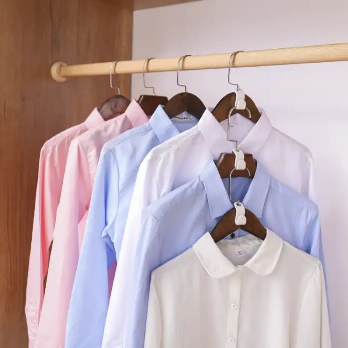 6 Hanger Connection Hooks showing neatly arranged pastel shirts hanging in an organized closet setup.