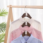 6 Hanger Connection Hooks displaying three shirts stacked vertically for space-saving closet organization.