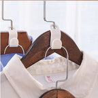 6 Hanger Connection Hooks used to connect multiple wooden hangers for vertical shirt arrangement.