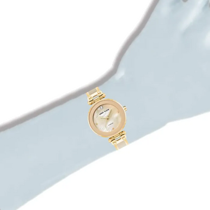 Anne Klein watch displayed on mannequin hand.