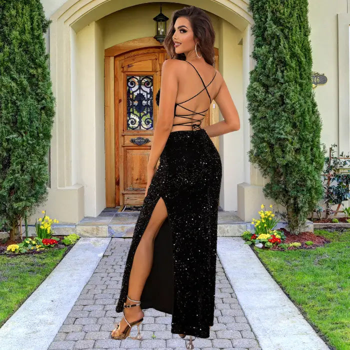 Glamorous black sequin prom dress featuring fitted silhouette, crisscross strappy back design and elegant side slit for formal occasions