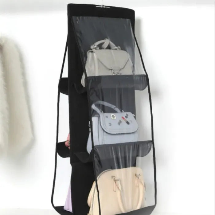 Black hanging organizer storing various handbags.