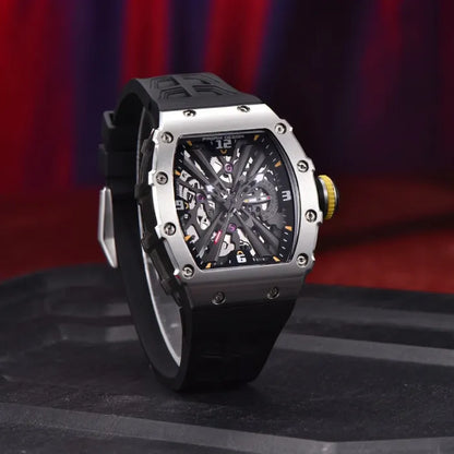 Pagani Design skeleton watch with a black strap on a textured black surface.