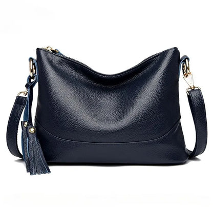 Elegant blue genuine leather women's bag with stylish tassel accessory.