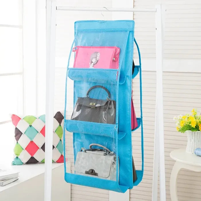 Blue hanging organizer displaying multiple handbags.