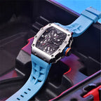 Pagani Design watch with a blue strap placed on a modern, vibrant backdrop. The skeleton dial and polished stainless steel case are prominently displayed.