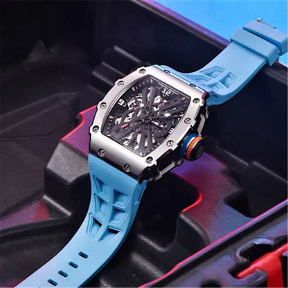 Pagani Design watch with a blue strap placed on a modern, vibrant backdrop. The skeleton dial and polished stainless steel case are prominently displayed.