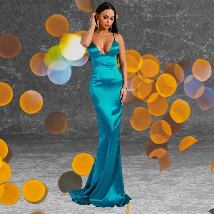 Glamorous teal satin mermaid formal dress with a V-neckline shown on model. Excellent choice when you need to buy a standout prom dress.